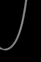 Close-up of a silver chain link glowing with a liquid metal sheen floating against pitch black background