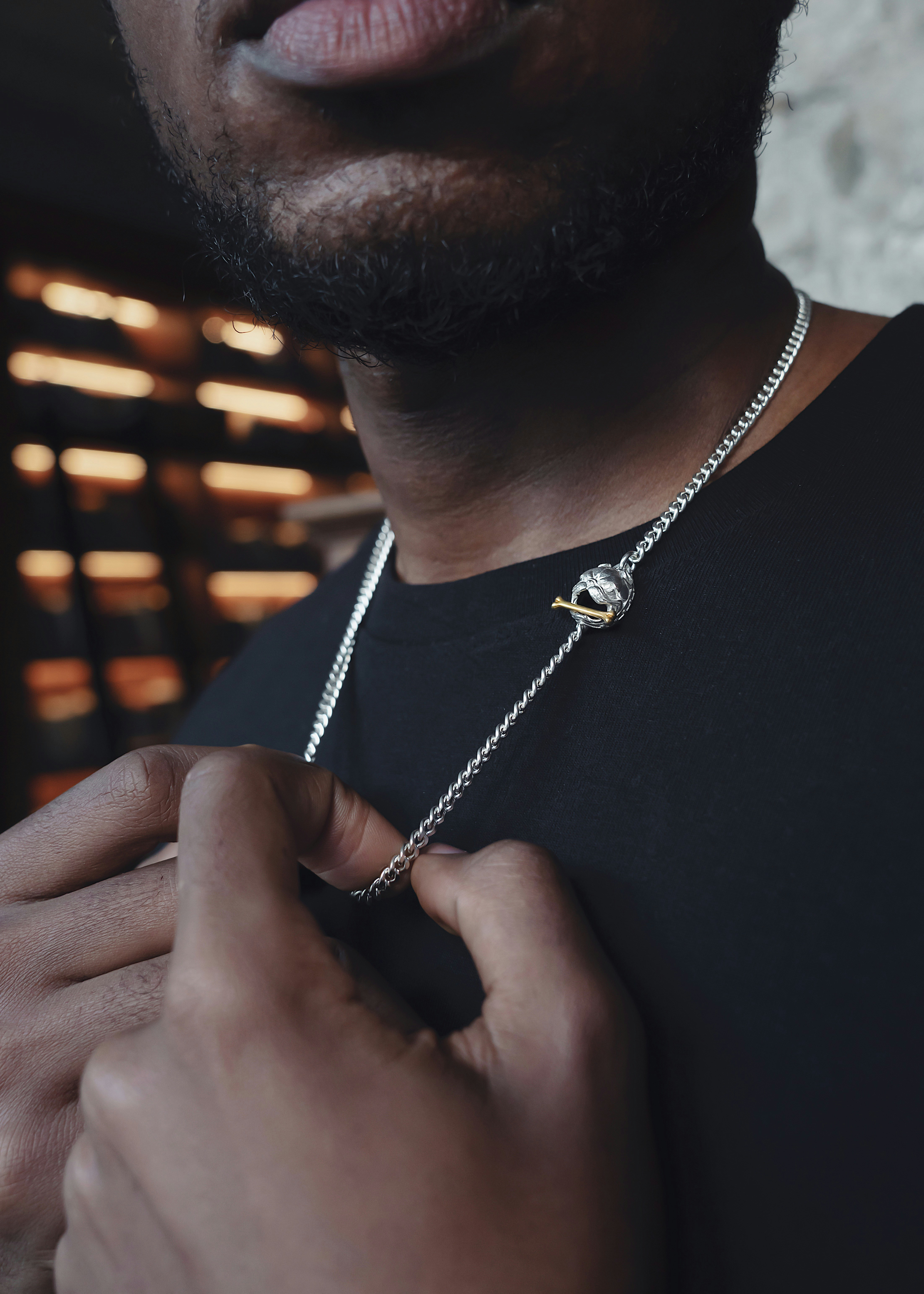 a close up of a person wearing a necklace