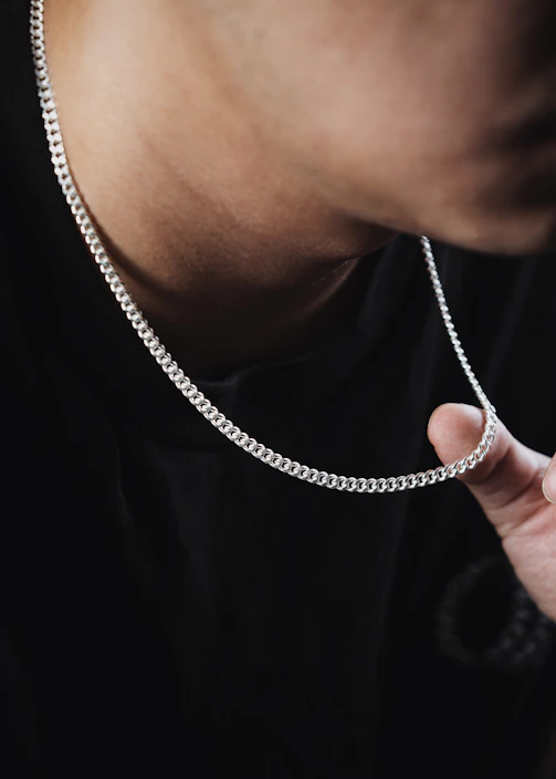 a man wearing a silver chain around his neck