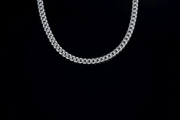 a silver chain on a black background