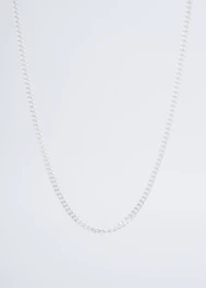 A minimalist choker necklace with a tiny star charm against a white background.