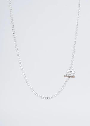 A modern men's silver necklace with a minimalist design on a black leather background.