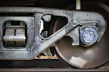 a close up of a train wheel on a train