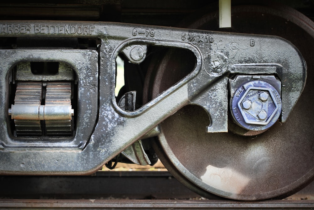 a close up of a train wheel on a train