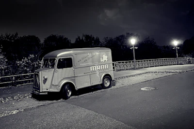 A clean, modern service van parked outside a classic San Francisco home at dusk.