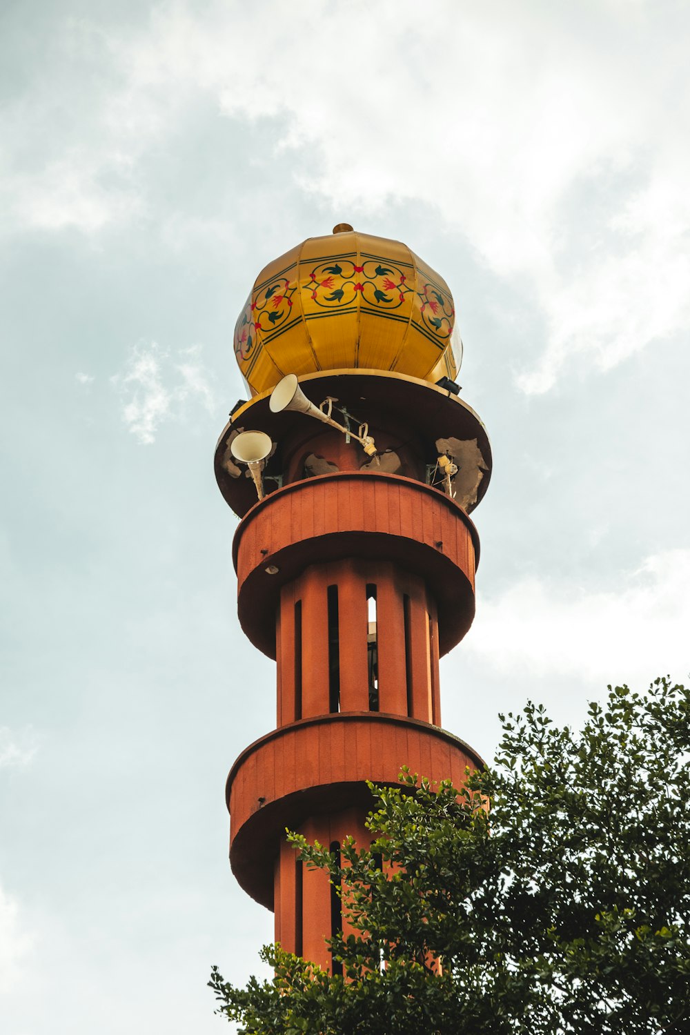 a tall tower with a clock on the top of it