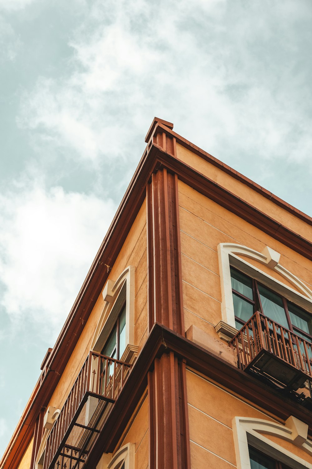 a tall building with a balcony and balconies