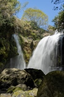 A picturesque waterfall cascading down rocky cliffs.