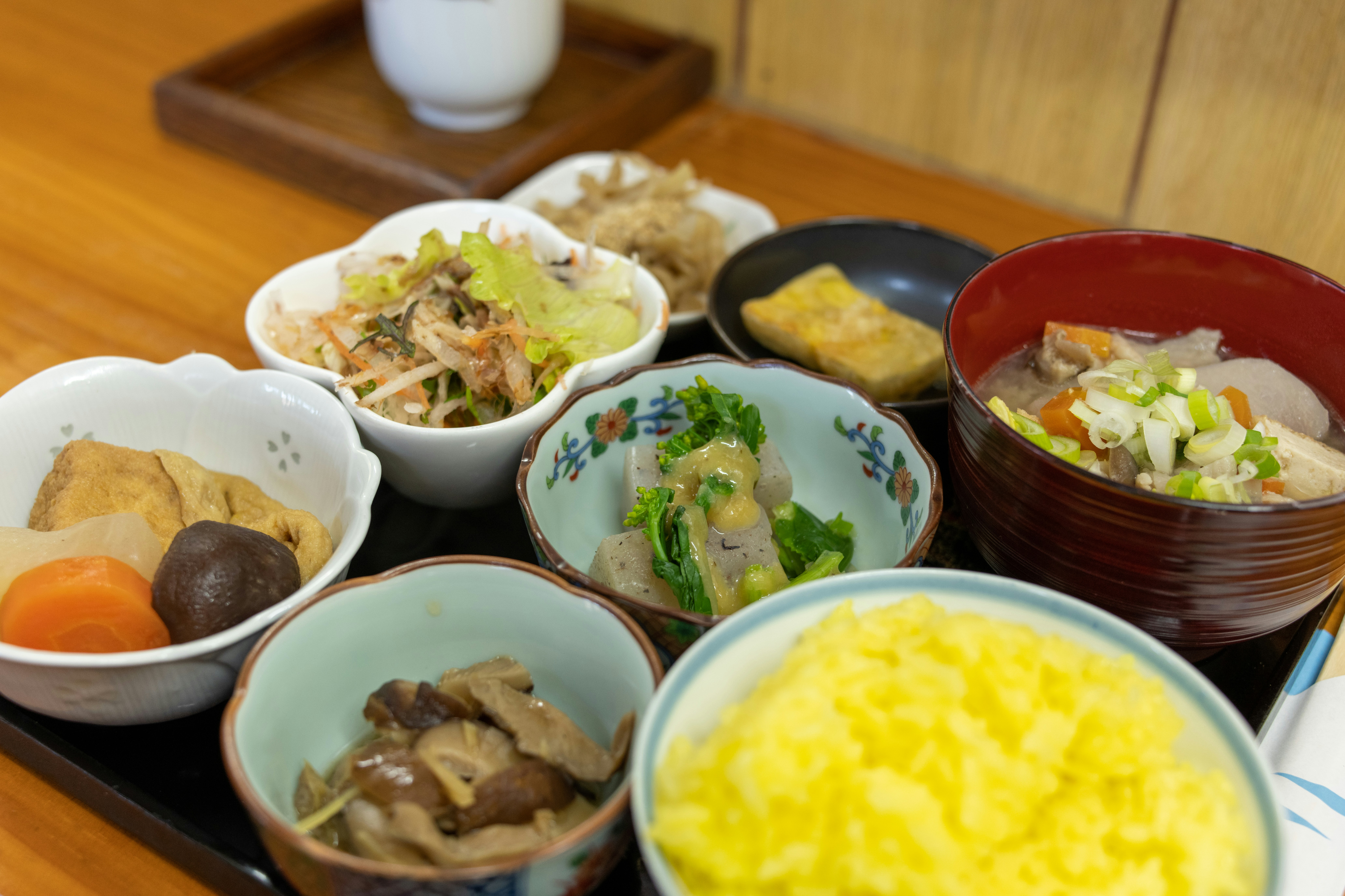 Kisa's vibrant spread of banchan dishes, showcasing a variety of colorful and appetizing small plates. - best new restaurants nyc