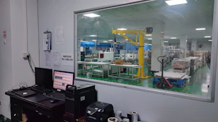 A factory floor with AI-powered robots assisting workers.
