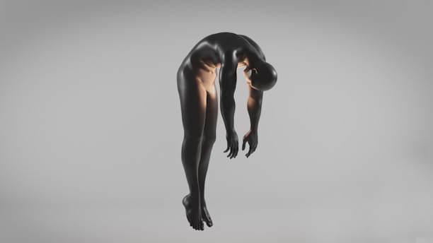 A black humanoid figure appears to be suspended in mid-air against a minimalistic gray background, with its arms and head hanging downwards.
