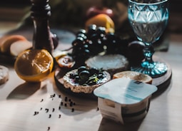 A colorful spread of healthy meals and supplements on a wooden table