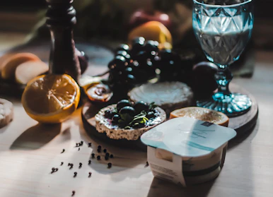 Fresh dairy products displayed on a rustic wooden table with natural light.