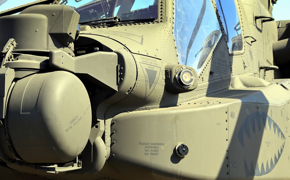 a close up of the front of a military helicopter