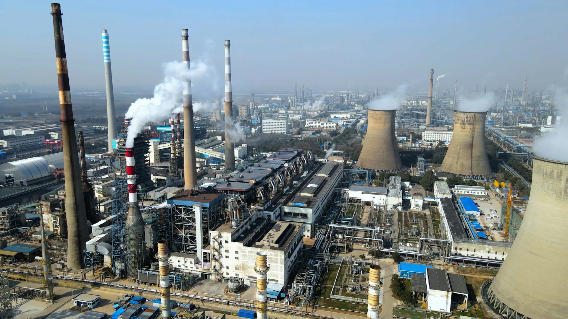 a factory with a lot of smoke coming out of it