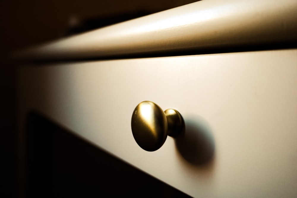 a close up of a door knob on a cabinet