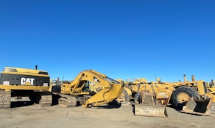 Picture of heavy equipment and building materials neatly arranged
