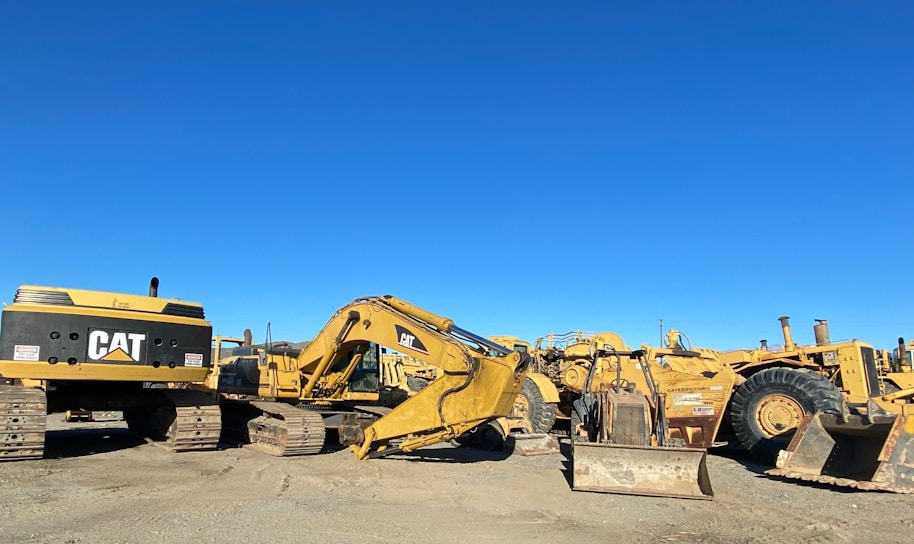 A collection of various construction equipment including excavators and bulldozers.