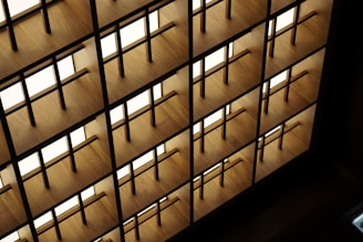 Custom steel shelving unit with geometric patterns against a dark wall