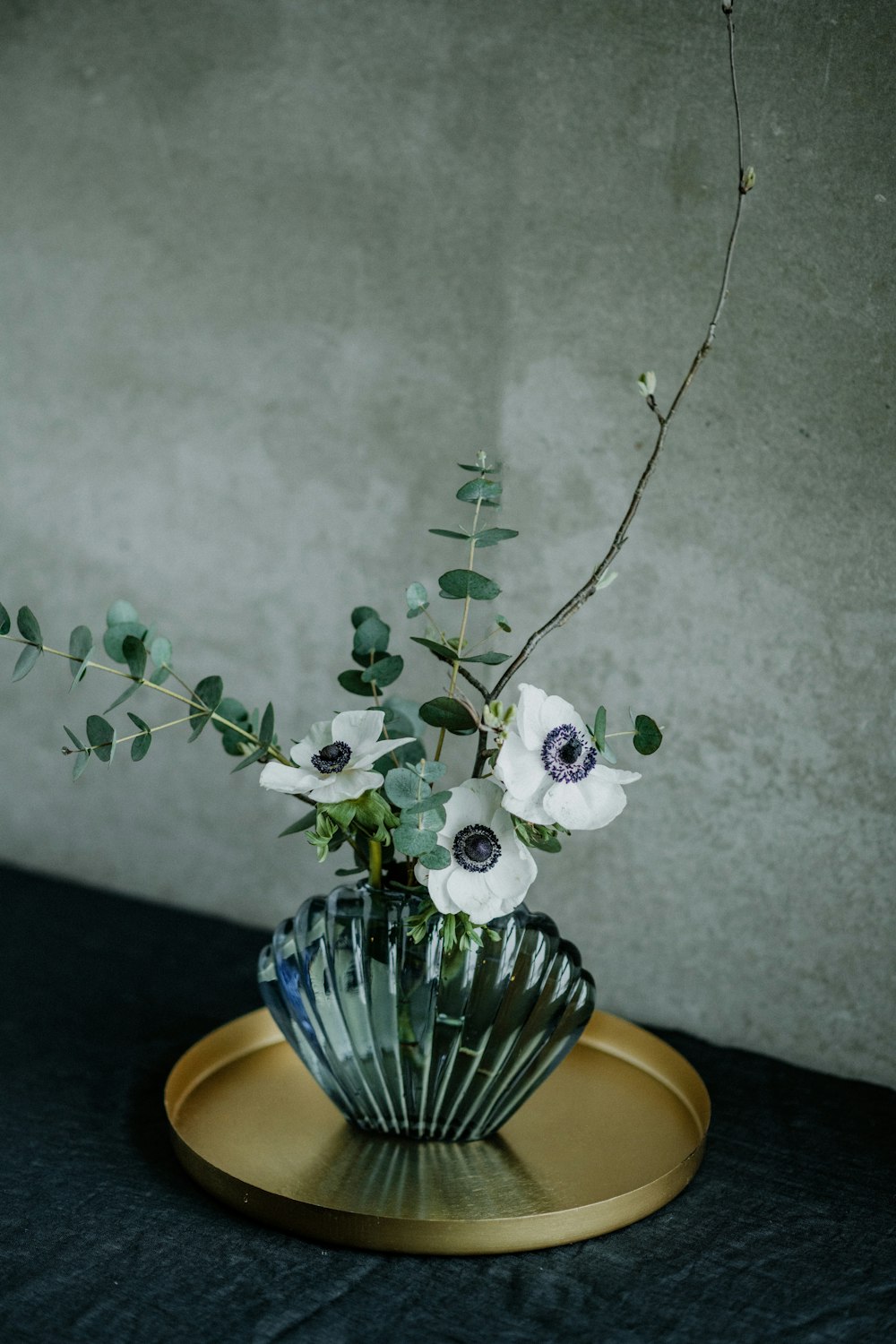 a vase filled with white flowers on top of a table