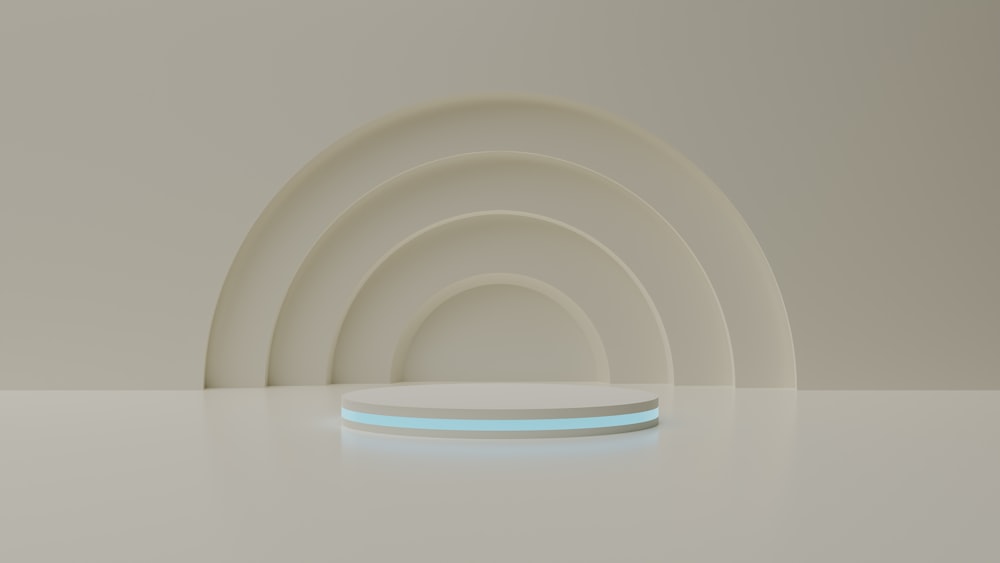 a set of four white plates with a blue light on the edge