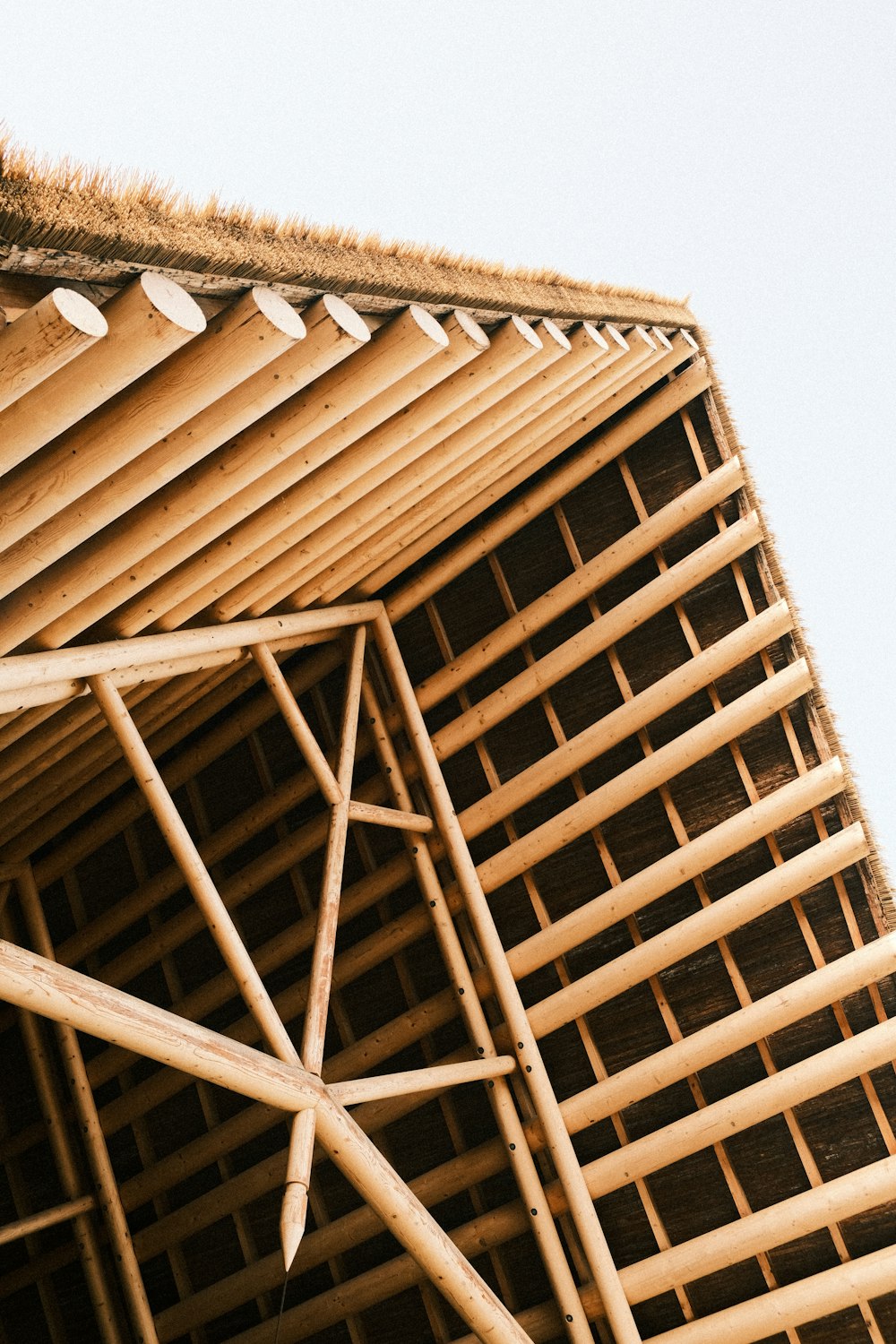 a clock on the side of a wooden structure