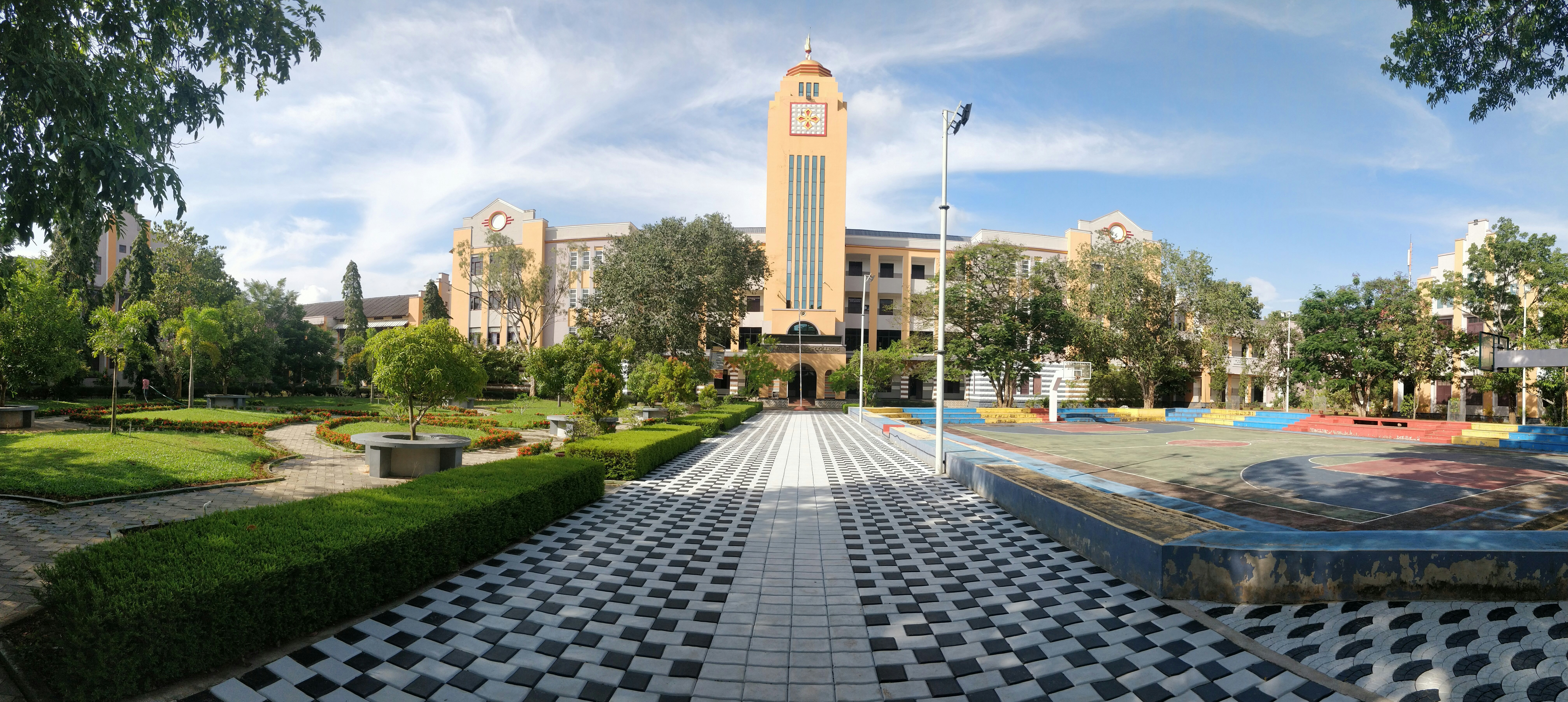 a large clock tower towering over a park