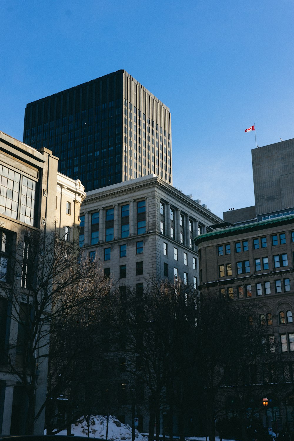 a group of buildings with a blue sky in the background