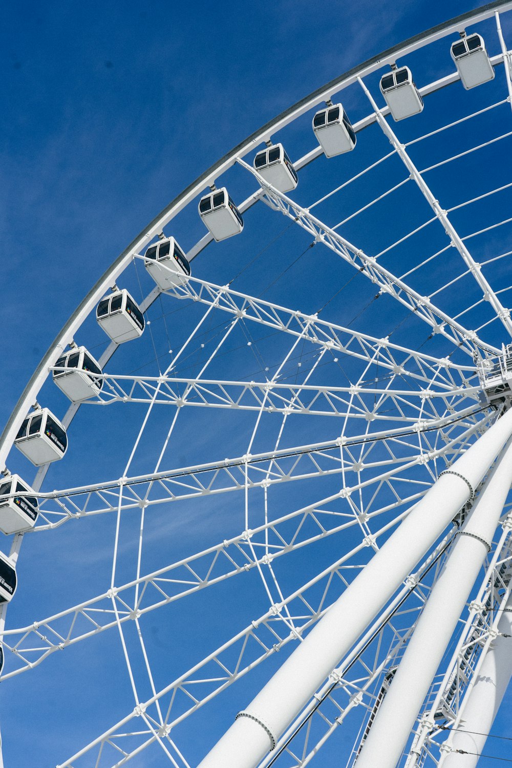 a large ferris wheel against a blue sky