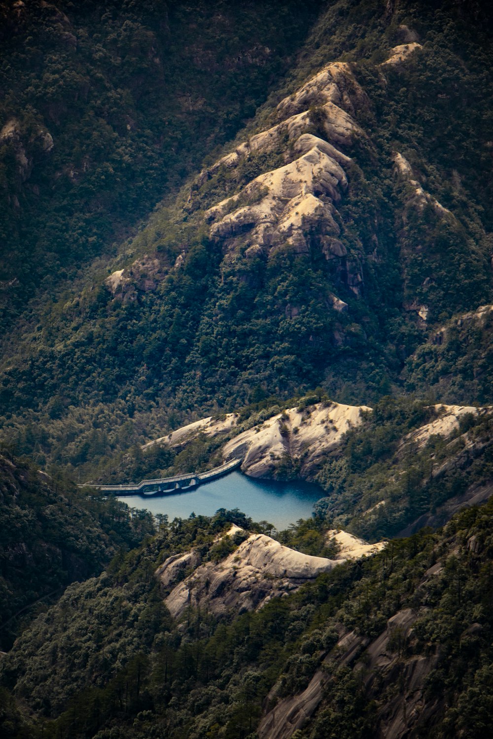 a mountain with a lake in the middle of it