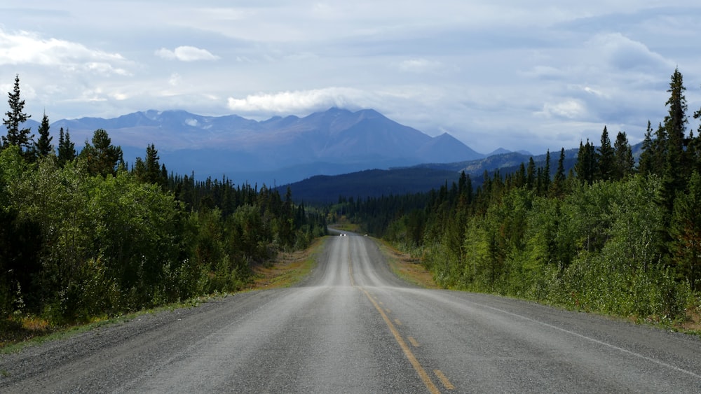 a road with a mountain in the background