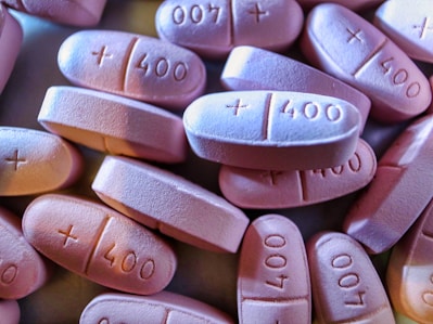 a pile of pink pills sitting on top of each other