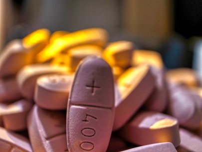 A variety of custom-shaped fentanyl pills showcasing different monograms.