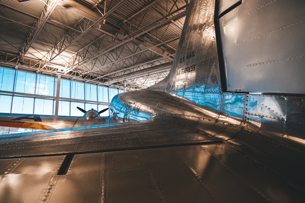 an airplane is parked inside of a building