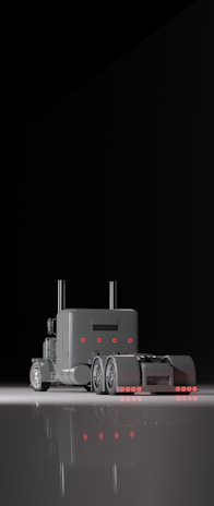 Sleek metallic truck cab illuminated under futuristic city lights.