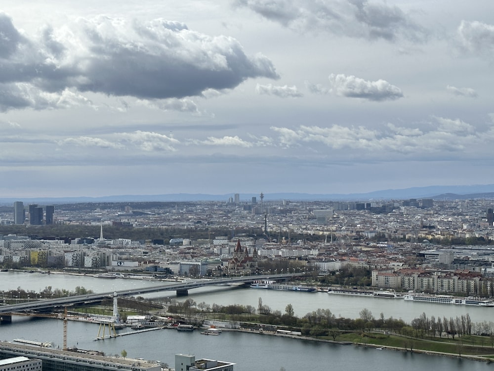 a view of a city with a bridge and a river