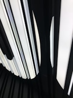 A minimalist black and white LED panel casting soft, even light in a modern office.