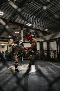 A group of athletes training in a mixed martial arts gym.