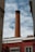 a tall brick chimney on top of a building