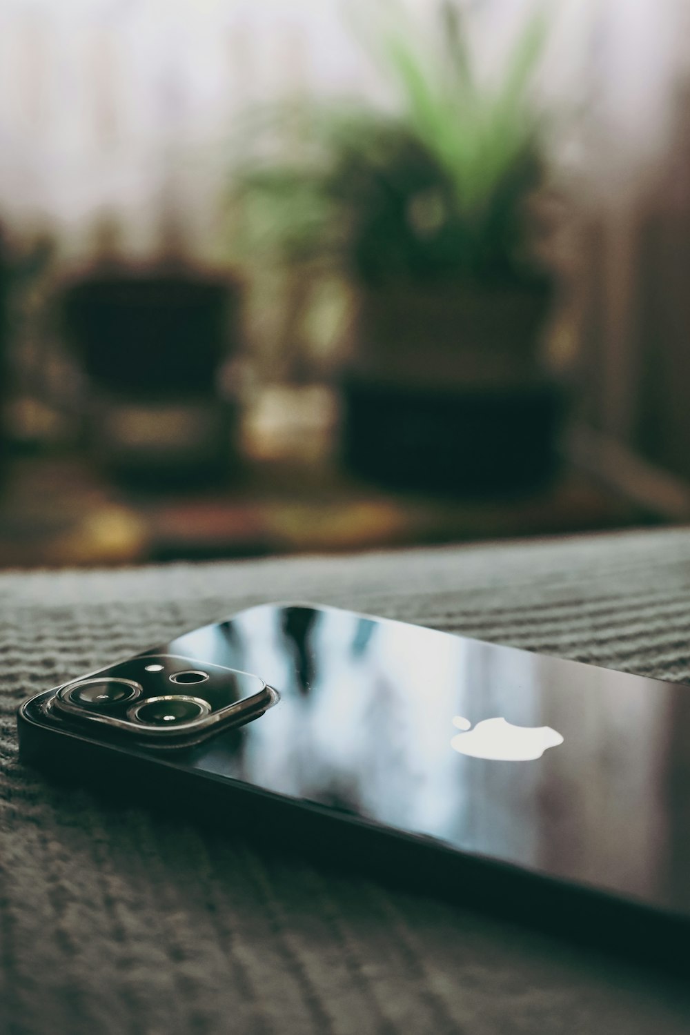 a close up of a cell phone on a bed