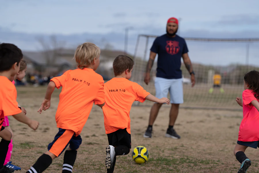 Children playing soccer on a field