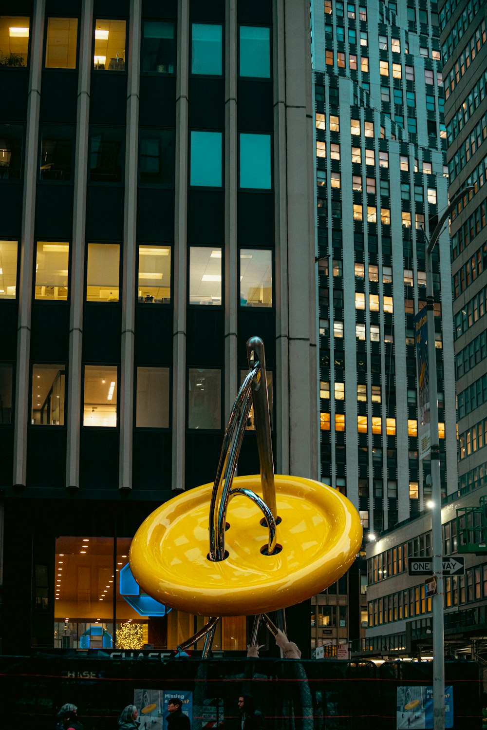 a large yellow object in the middle of a city