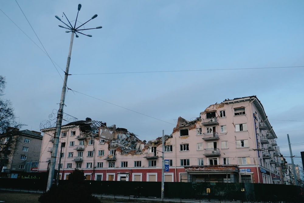 a building that has been torn down and is next to a street light