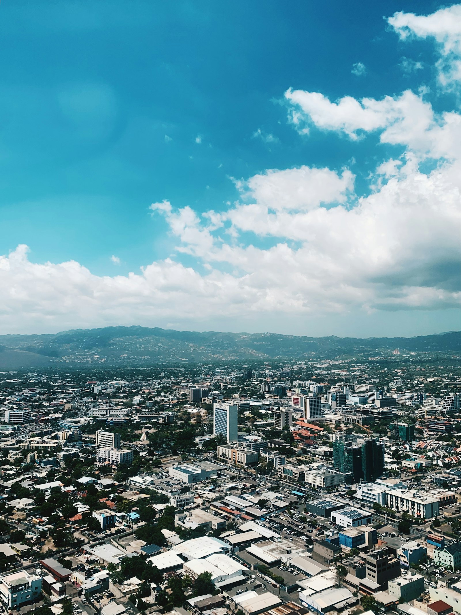 Kingston Jamaica aerial city skyline with mountains backdrop filming location