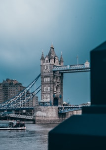 a boat is in the water near a bridge