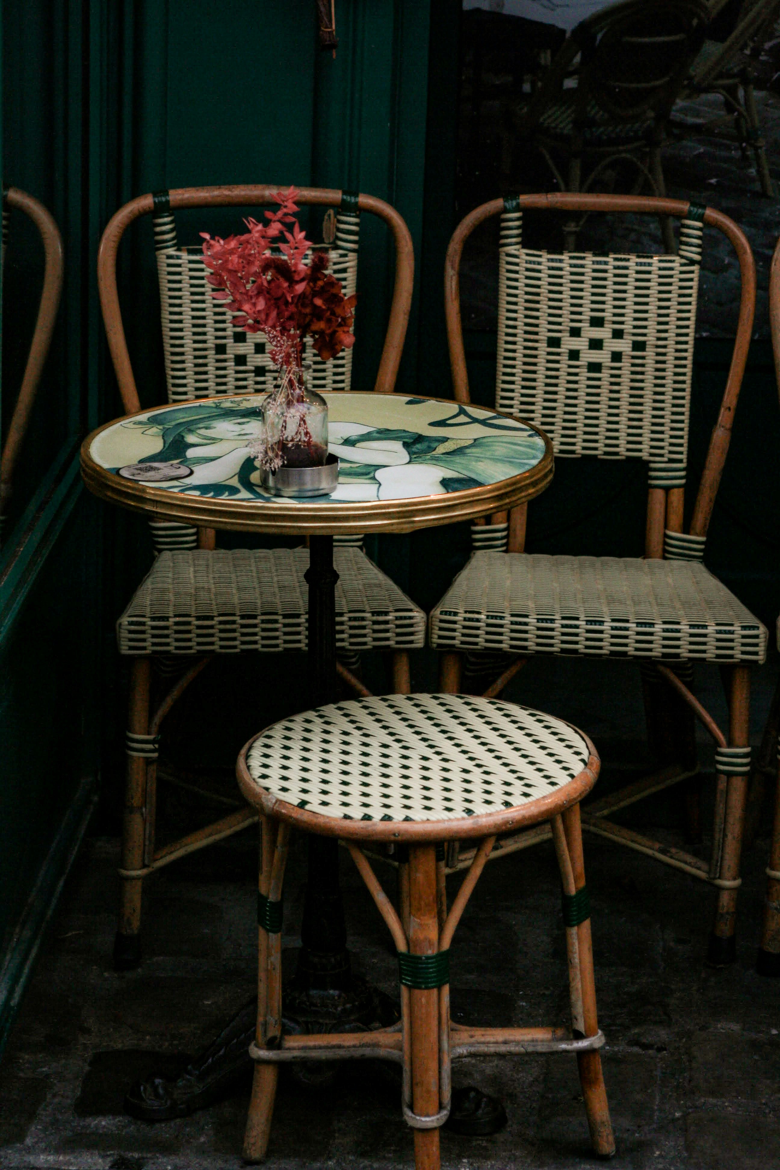 a couple of chairs sitting next to a table