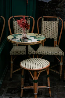 a couple of chairs sitting next to a table