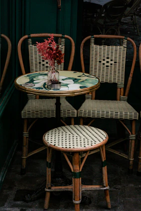 a couple of chairs sitting next to a table