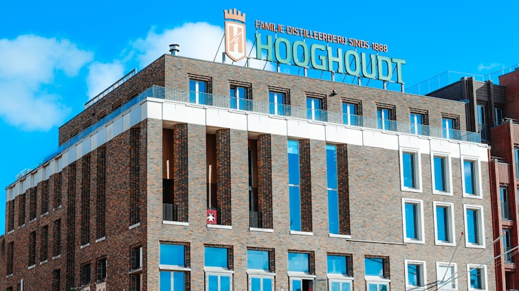 A modern office building in the Netherlands with the j. westgeest holding b.v. logo on the entrance.