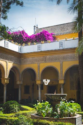 An elegant riad courtyard bathed in warm sunlight, inviting guests to relax.